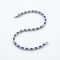 Bracciale tennis con zaffiri blu e pietre bianche